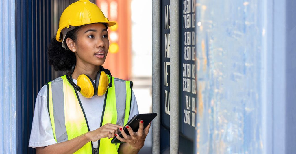 Woman in hardhat performing asset management